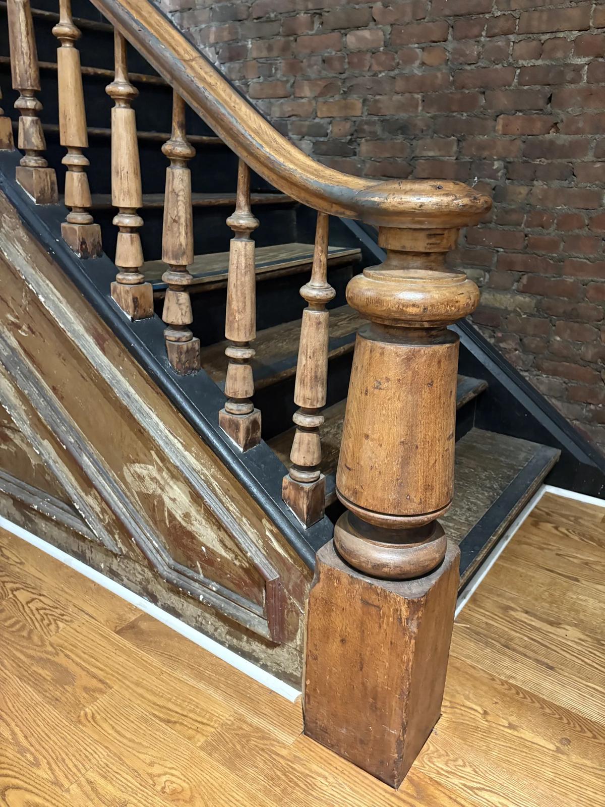 Close-up of the antique turned newel post and balusters